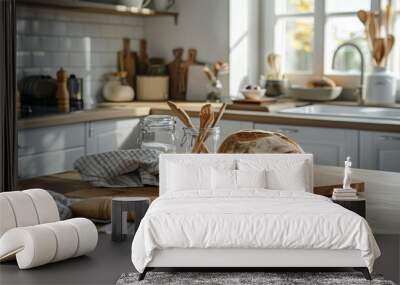 Fresh bread and utensils on the kitchen table in a simple scandinavian kitchen Wall mural