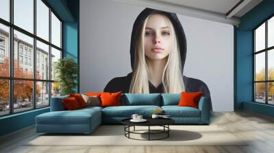 Blonde girl in hoodie with one emotion Wall mural