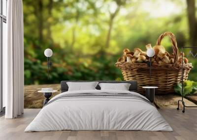 Wicker basket and fresh champignon mushrooms on wooden table against blurred background with space for text. Cooking delicious organic food boletus mushroom Wall mural