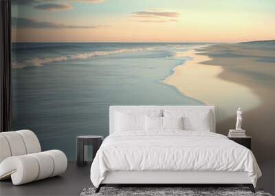 tranquil beach at sunrise with soft waves gently touching the shore Wall mural