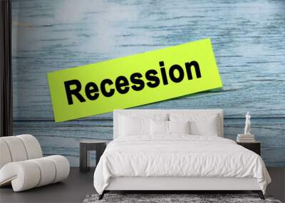 Recession wording or text on green paper with blue background.Copy space and business concept. Wall mural