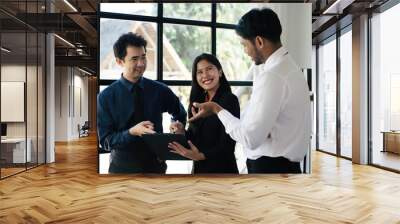 Multiethnic business people working together in the office, Corporate business team and manager in a meeting, A group of business people partners during a set team meeting in the modern office. Wall mural