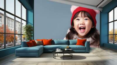 Asian girl smile in santa claus red hat, Christmas background design Wall mural