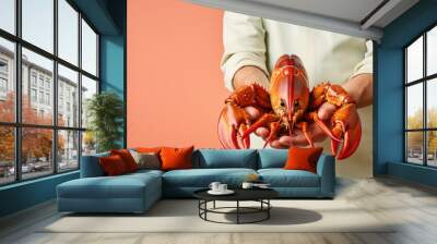 Hands holding fresh lobster on pastel background, fresh food ingredients, Healthy food Wall mural