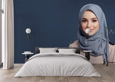 Hijab woman in navy uniform smiling isolated on pastel background Wall mural