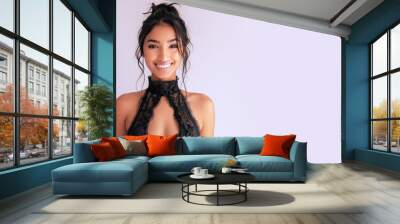 Indian elegant woman in black halter neck dress isolated on grey Wall mural