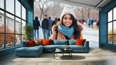 Indian girl doing outdoors activity at snowy park in winter Wall mural