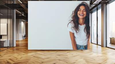 Indian woman wear white t-shirt smile isolated on grey background Wall mural