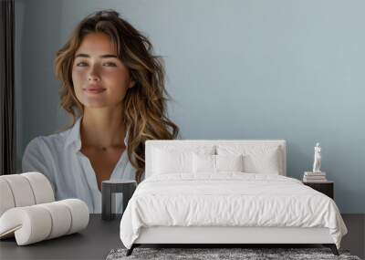 Latin business woman in white shirt smiling looking up towards copy space Wall mural