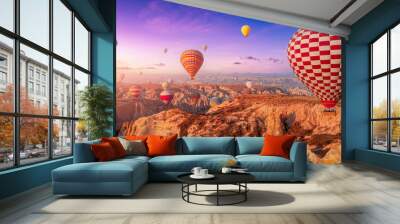 Amazing Panoramic view sunrise rocky landscape in Cappadocia with colorful hot air balloon deep canyons, valleys. Concept banner travel Turkey Wall mural