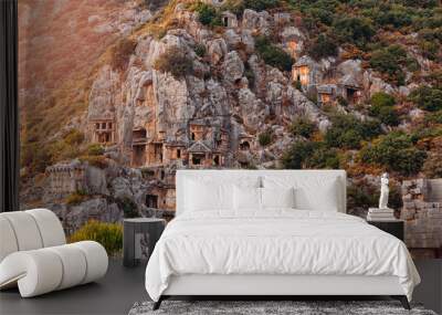 Ancient tomb ruins of Myra City in Demre to Antalya, archaeology landmarks of Turkey sunset light Wall mural