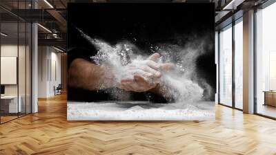 Chef clap white flour dust man hand on black background Wall mural