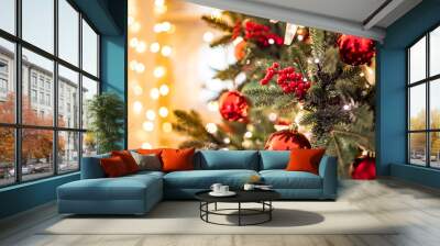 Christmas background pine tree branch with decorations red balls gifts and star, with bokeh light Wall mural