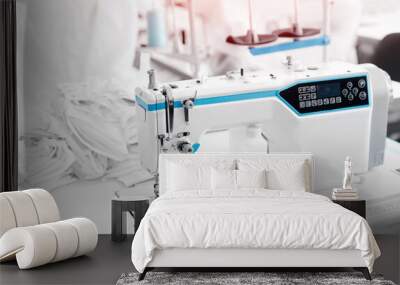 Closeup sewing machine with thread, background white color sun light. Concept Interior of garment factory Wall mural