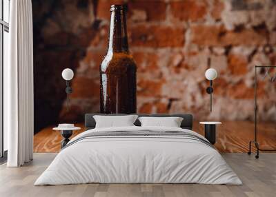 Cold ice beer brown bottle glass with drops of water against brick wall. Concept craft brewery Wall mural