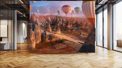 Group horse riding tour with hot air balloons in Cappadocia autumn landscape Turkey top aerial view Wall mural