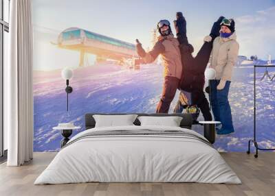 Group of friends with snowboard and ski on winter holidays having fun on snow Wall mural