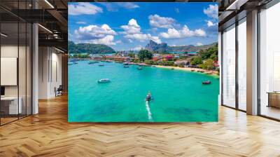 Island Phi Phi with longtail boat, turquoise clear water in Krabi Thailand. Amazing travel landscape photo in Thai Wall mural