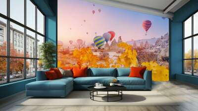 Landscape sunrise in Cappadocia with set colorful hot air balloon fly in sky with sun light. Concept tourist travel Goreme Turkey Wall mural