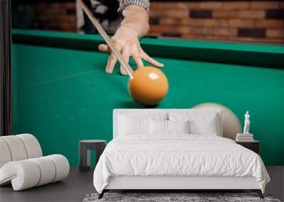 Russian billiards, man plays and beats cue on white ball Wall mural