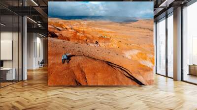 Tourist traveler on Altai landscape republic Russia. Red color sand and clay Mars Altay, Aerial drone view Wall mural