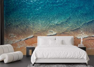 Turquoise water with wave with sand beach background from aerial top view. Concept summer sunny travel image Wall mural