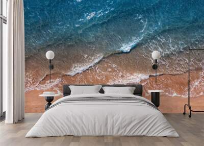 Turquoise water with wave with sand beach background from aerial top view. Concept summer sunny travel image Wall mural