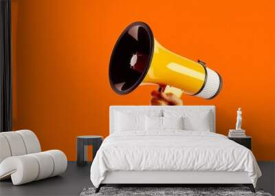 Hand holding megaphone, marketing and sales, orange background, Generative AI Wall mural