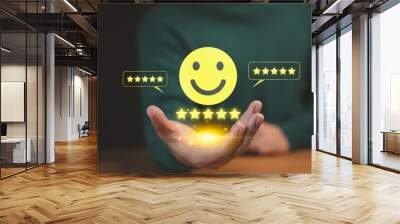 Best Excellent Services Rating. Customer show virtual screen on smile face icon with five stars. Business concept of testimonial customer service and feedback, good, the best of product and service. Wall mural