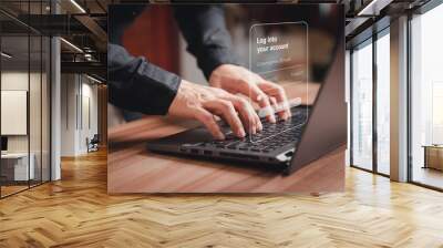 Young man typing his user and password on a computer laptop. Secure encryption and access to the user's private information to access the internet. Cyber security concept to protect personal data. Wall mural