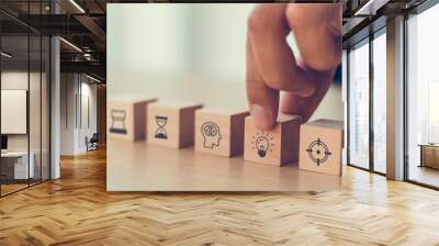 business man hand arranging wood block . icon of business strategy including element with goal, idea, leadership, management of time, Knowledge, Initiative, Human relations with copy space Wall mural