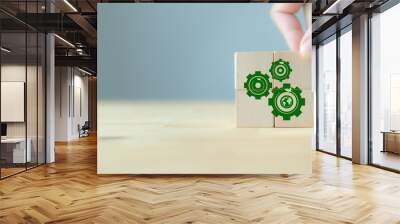 Natural climate solutions concept. Action for avoid greenhouse gas emissions and increase carbon storage in forests, grassland and wetlands. Green gears and globe with leafs on wooden cube blocks. Wall mural