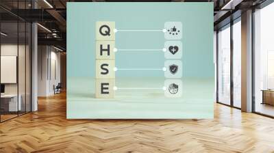 QHSE-Quality Health Safety Environment. Safety and health at workplace concept. Maximize value by successfully implementing QHSE management system. QHSE text and symbols on wooden cube blocks. Wall mural