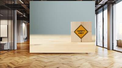 Safety symbols and first signs, work safety, caution work hazards, danger surveillance, zero accident concept on wooden cubes with beautiful  grey background and copy space. Safety banner.. Wall mural