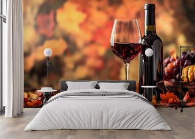 A rustic wine tasting setup with a large glass of dry red wine, an open wine bottle, and autumn leaves, with a blurred background Wall mural