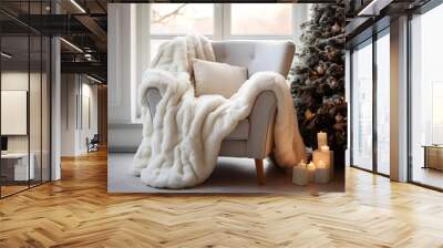 Ivory snuggle chair with fur plush blanket near decorated christmas tree. Hygge new year winter holiday home interior design of modern living room. Wall mural