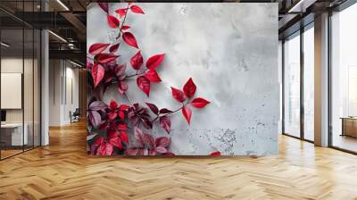 Nature background with red plant leaves over grey concrete wall Wall mural