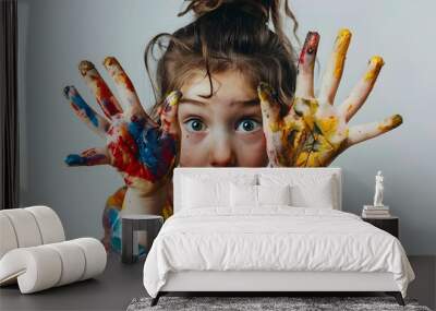 portrait of a funny child girl shows hands dirty with paint Wall mural