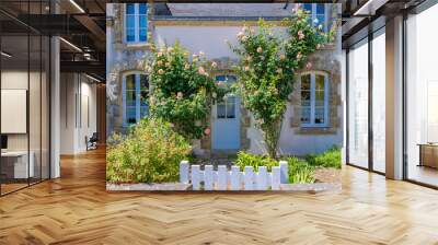 Beautiful small house in Brittany, typical home with rosebush and a wooden gate Wall mural