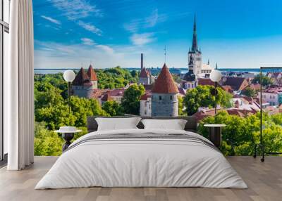 Tallinn in Estonia, panorama of the medieval city with Saint-Nicolas church, colorful houses and typical towers  Wall mural