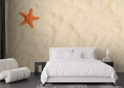 Seashells on sand with white paper in center Wall mural