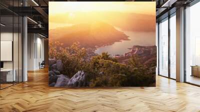 Happy Couple Watching the Sunset in the Mountains Wall mural