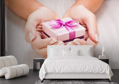 Small gift in women hands Wall mural