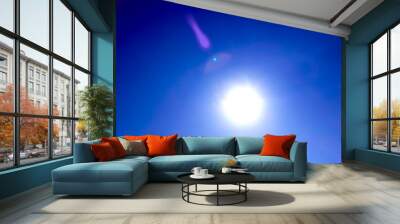 Blue sky with sun. Wall mural