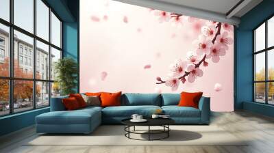 A pink background with a branch of a cherry blossom tree Wall mural