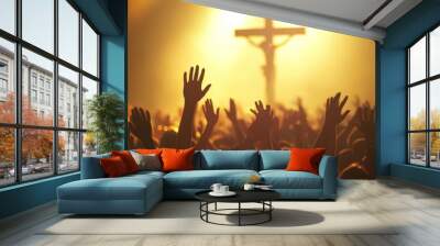 Christian worshipers raising hands up in the air in front of the cross. Wall mural