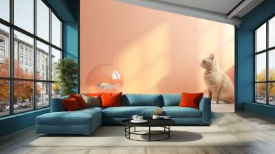 In minimal pastel peach room cat looking at the goldfish Wall mural