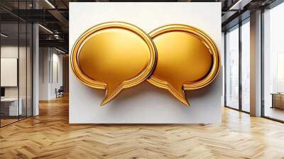 Two golden speech bubbles symbolizing communication, dialogue, and conversation on a simple background. Wall mural