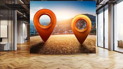 Two vibrant location pins stand against a scenic sunset background, symbolizing navigation and travel. Wall mural