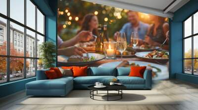 Family having lunch together. Group of friends enjoying dinner at the beach. Party, celebrate concept Wall mural